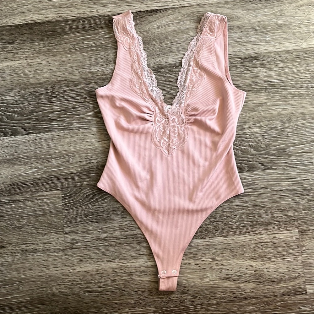 Pink low cut laced edges body suit